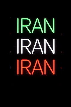 Iran Neon Sign in Green White and Red on Dark Background