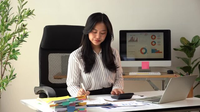 Business financing accounting banking concept. Business woman hand doing finances and calculate on desk about cost at home office. Woman working on desk with using calculator, finance accounting.