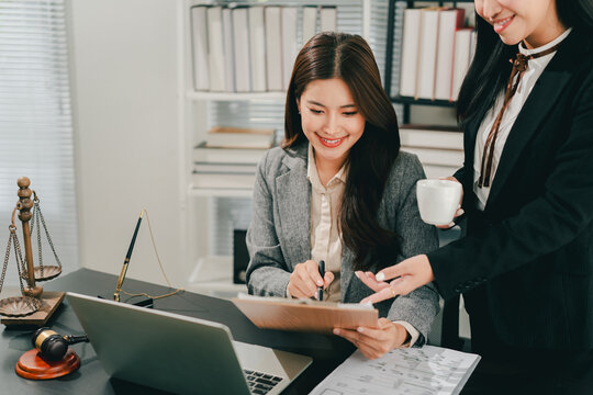 A female lawyer who trains and mentors new employees at the law firm.