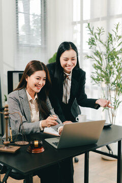 A female lawyer who trains and mentors new employees at the law firm.