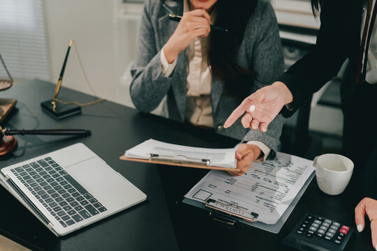 A female lawyer who trains and mentors new employees at the law firm.