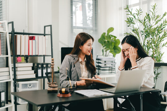 A female lawyer who advises clients at a law firm.