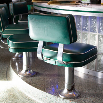 Green diner stools at counter