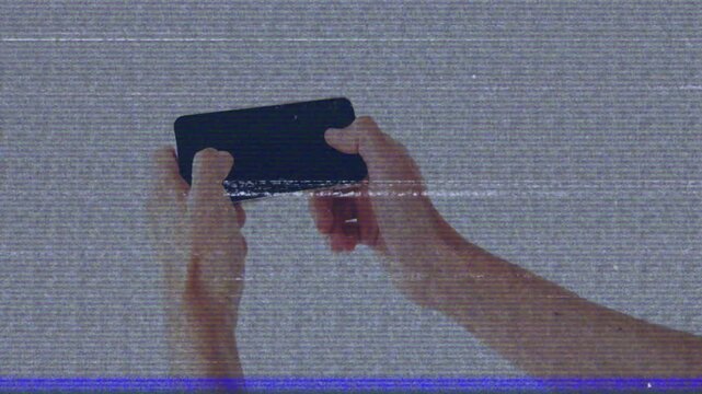 Thumb tapping starting hands holding phone rotating and tilting, showing interaction with scanline