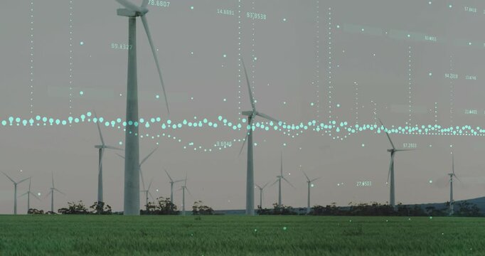 Wind turbines rotating, driven by wind, while teal data overlay animating to visualize power output