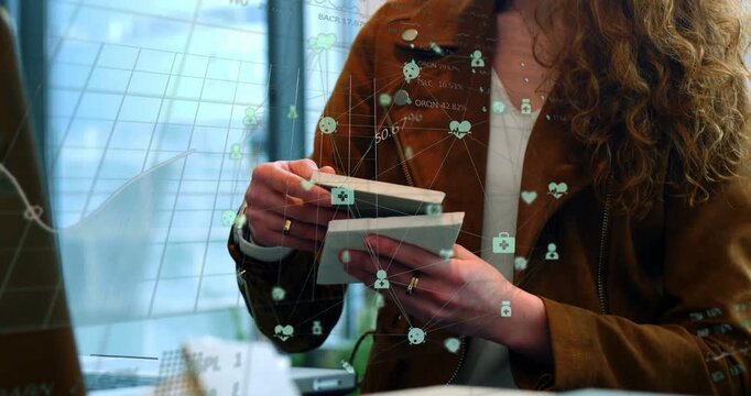 Camera pulling back revealing designer flipping samples as overlay icons and charts guiding design