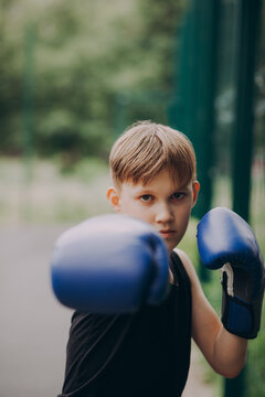 Young boxer practicing outdoors with focus and determination