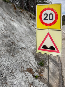 Road sign indicating speed limit and bump warning