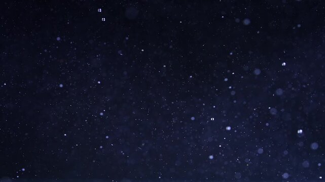 Ice cube falling into water with oxygen bubbles, frost patterns, and soft light reflections. Concepts for beauty advertising, menu designs for bars and restaurants, cryotherapy.