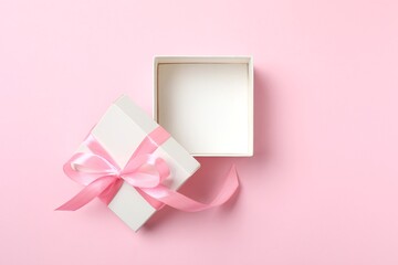 Open gift box on pink background. Top view