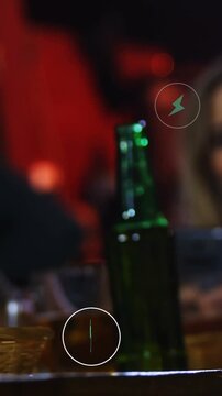 Vertical video: Plug icon appearing, glass and bottle shifting, icons pulsing to show phone link