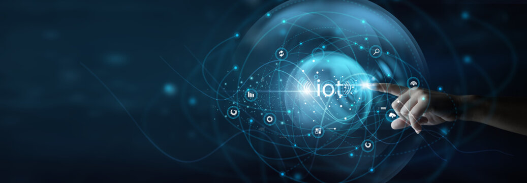 Technology engineer holding connected devices. IoT connects sensors and smart devices to collect data and enable automated, real-time monitoring.