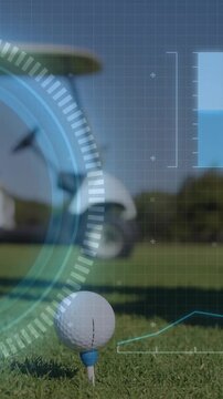 Vertical video: Gloved hand placing golf ball on blue tee starting tech HUD over ball readying shot