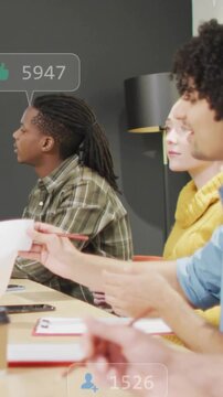 Vertical video: Overlays appearing, team passing papers and taking notes, showing social counts