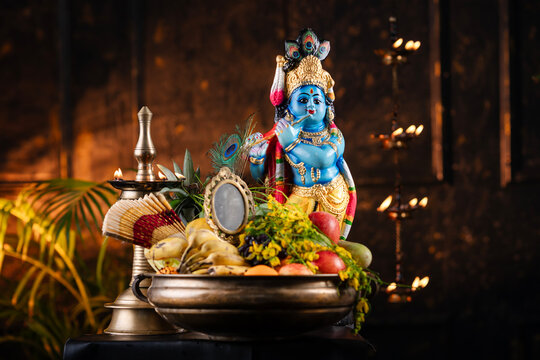 Vishu festival photo beautidul Vishu kani image with Lord Krishna statue with fruits and traditional lamp