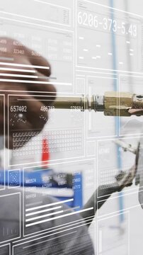 Vertical video: Shop tech pushing shaft into mount to seat ring, pressing red valve, HUD guiding