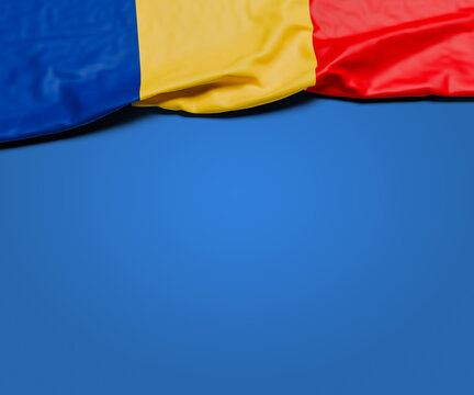 The wrinkled flag of Romania draped onto a flat blue background with shadow. Copy space for message