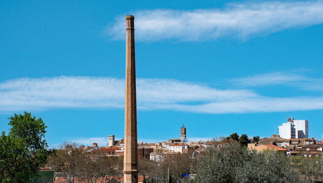 Requena, Valencia: panoramic view of the city with a large chimney