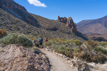 Obraz premium Two men with backpacks in Teide National Park. Tenerife. Canary Islands.