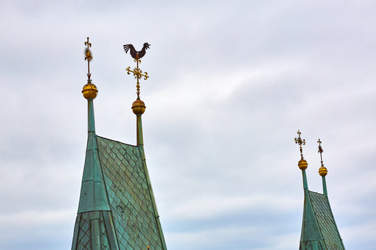 Gothic cathedral steeples with weather vane against cloudy sky. March 15, 2026, Hradec Kralove, Czech Republic
