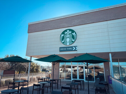 Mobile, Alabama, USA - February 22, 2026: Drive-thru Starbucks cafe in Mobile Alabama with customers and modern building design