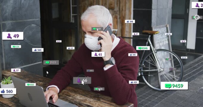 Animation of social media icons and numbers over man using tablet