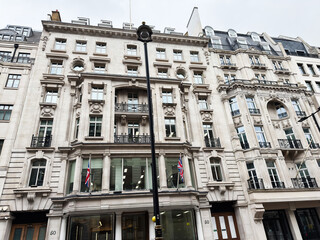 Fototapeta premium Elegant historic stone building facade with ornate architecture in London UK city centre