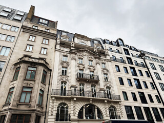 Fototapeta premium Historic neoclassical building facade on a London, UK street with ornate balconies and tall windows