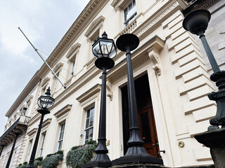 Fototapeta premium Historic London, UK townhouse facade with ornate lanterns and neoclassical architectural details