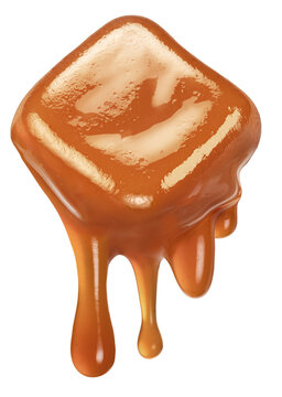 Caramel candy and drops of milk caramel sauce flowing down from it. File contains clipping path.