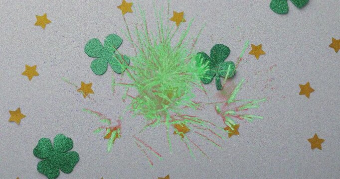 Animation of fireworks over clovers and stars