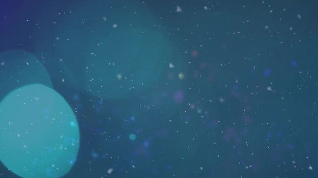 Animation of snow falling over moon and stars