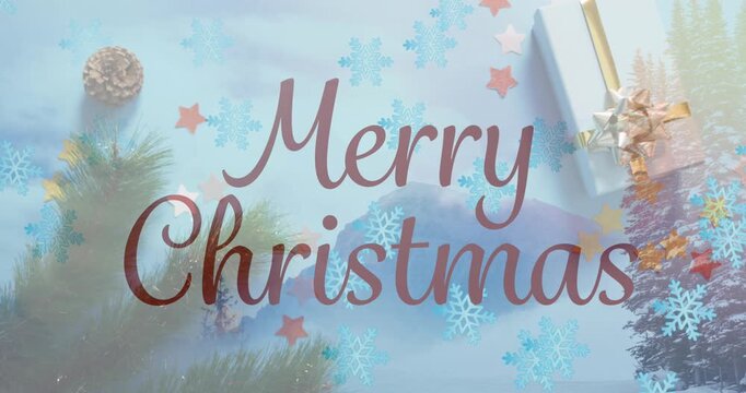 This video clip shows merry christmas text over a winter scenery with falling snow