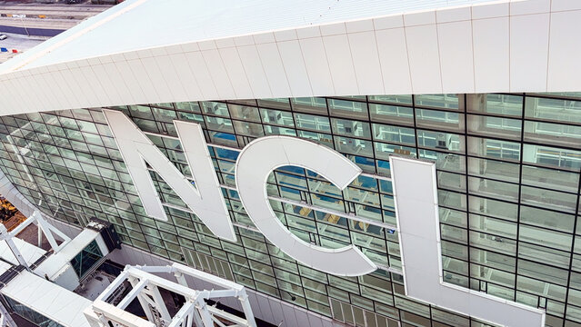 Miami, Florida, USA - 4 January 2025: Logo on the side of the cruise terminal for the Norwegian Cruise Line in the Port of Miami.