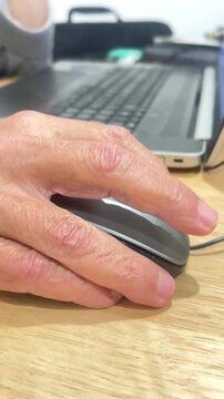 Close up elderly man hand using laptop  video vertical