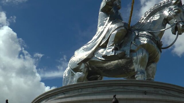 Ulaanbaatar, Mongolia - July 31, 2015: A huge monument of Chinggis Khan in Mongolia on the background of blue sky and clouds moving.