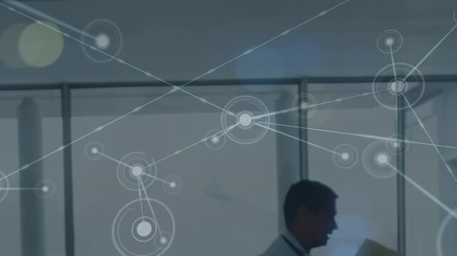 Animation of network of connections with icons over walking caucasian doctor