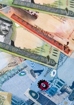 Bahraini dinar money bills pile on table. Bahrain banknotes of BHD currency close up.