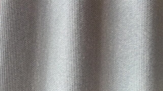 Close-up ondulin roofing tile texture showing corrugated gray waves with fine fibrous grain, subtle light and shadow, suited.