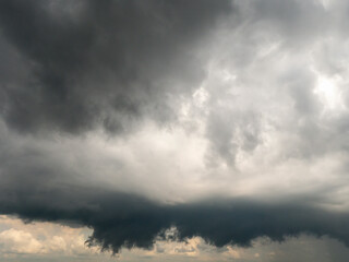 Fototapeta premium Dark and moody storm sky. Nature background for design. Black and white tones. Rough form and shape.