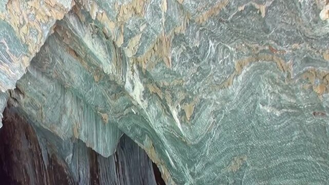 Nature's artistry unfolds in the Marble Caves, Patagonia. See blue and gray marble formations revealing ancient swirling patterns. Explore this stunning geological wonder near General Carrera Lake.