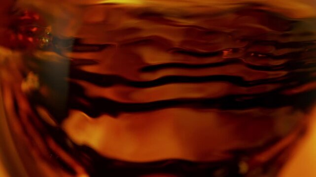 Super Slow Motion Shot of Waving Whiskey Background at 1000fps.
