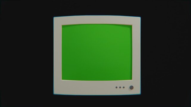 old desktop computer monitor on black background, with green screen