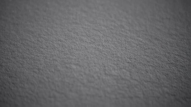 Close-up view of a textured, dark gray surface