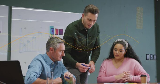 Facilitator leaning and pointing, uncapping marker, writing, shifting, team watching, updating plan