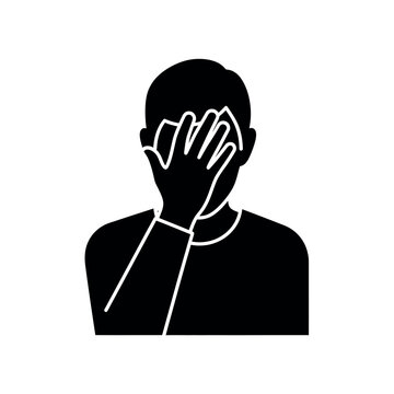 Man covering face with hand in shame or embarrassment.