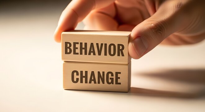 Behavior Change Concept - Wooden Blocks with Words Held by Hand