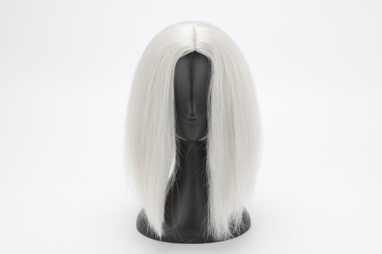 Plastic Mannequin Head with Silver Wig on White Background