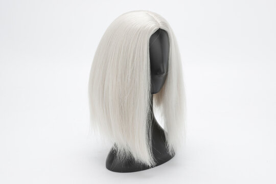 Plastic Mannequin Head with Silver Wig on White Background