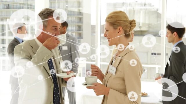 Two business professionals holding cups, woman gesturing and growing node network linking pair